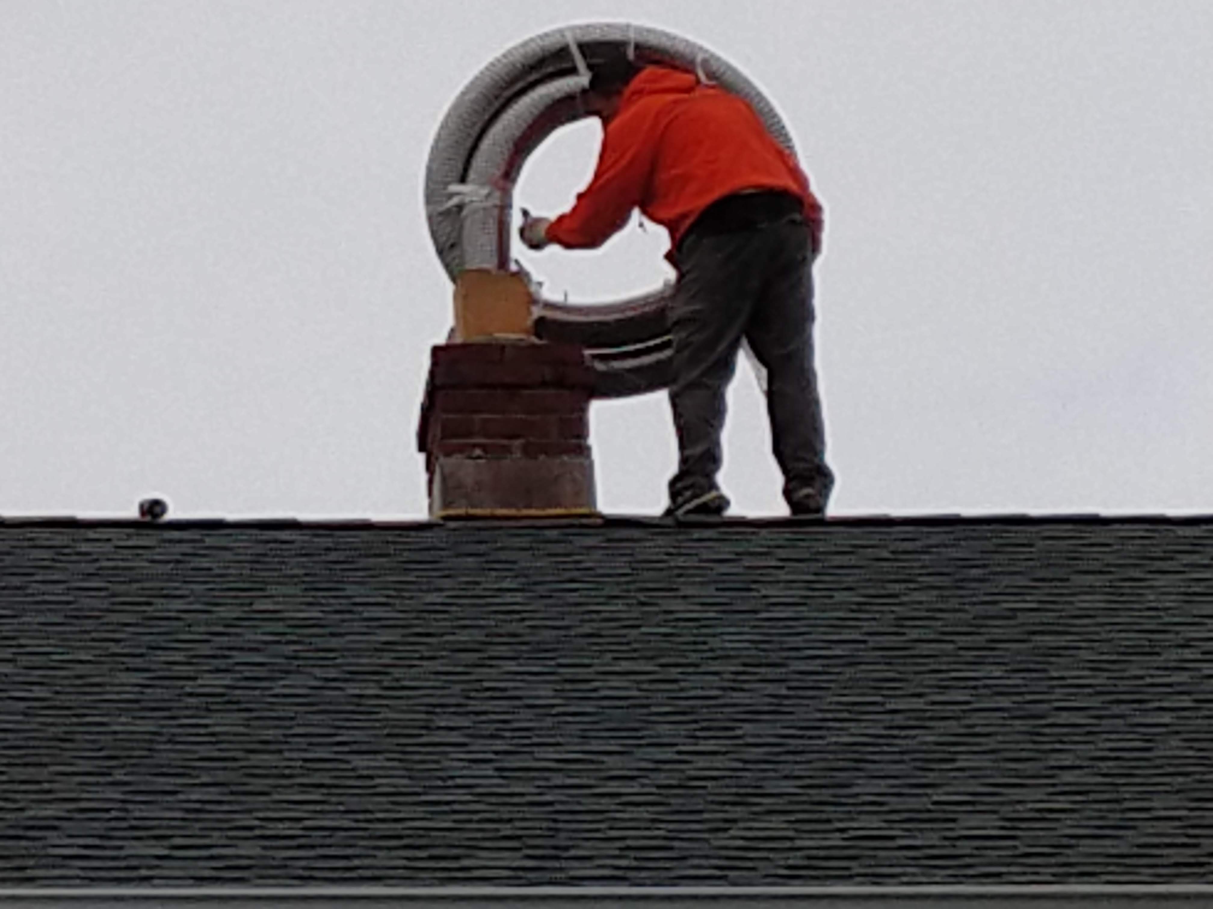 Flexible stainless chimney liner being installed in Bellmore, New York