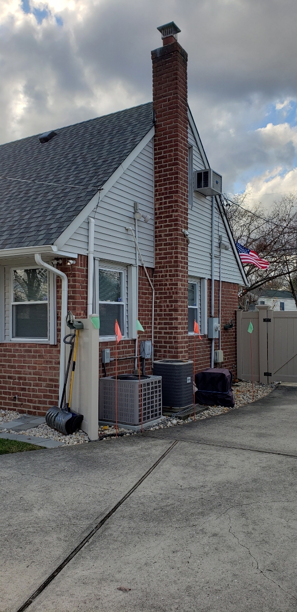 Professional chimney repointing restoring brick joints in Bellmore, NY
